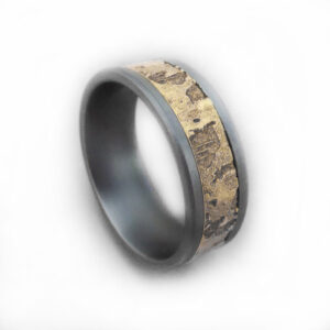 Textured titanium ring with a parchment-textured gold insert